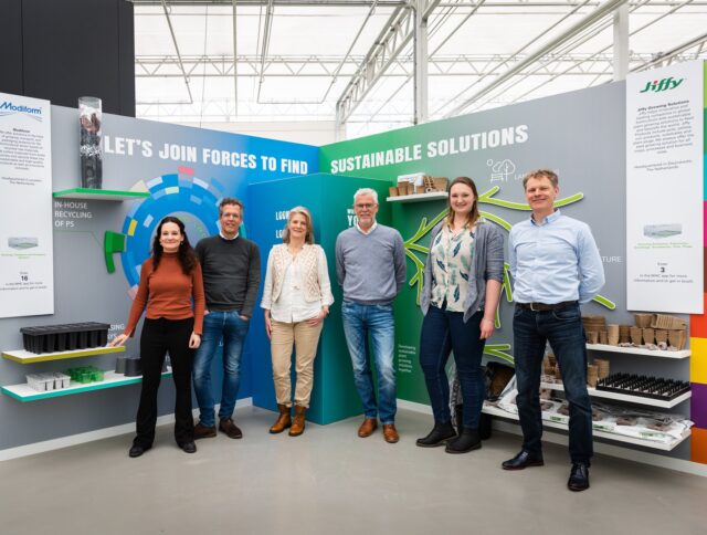 An image showcasing Thorleif Hals, CEO of Jiffy Group, with a smile, standing beside an indoor agriculture production of lettuce. A white message overlay reads, "An Exclusive Interview with Thorleif Hals, CEO of Jiffy Group, for Newsweek Magazine."